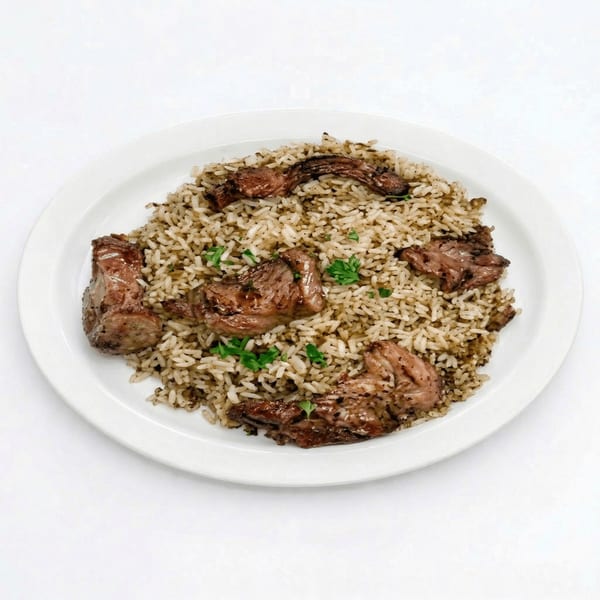 A white plate holds a serving of rice and dark meat, garnished with parsley.